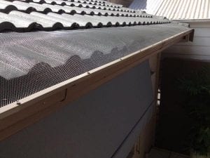 Gutters with All-flow gutterguard to protect house from leaf debris or burning embers